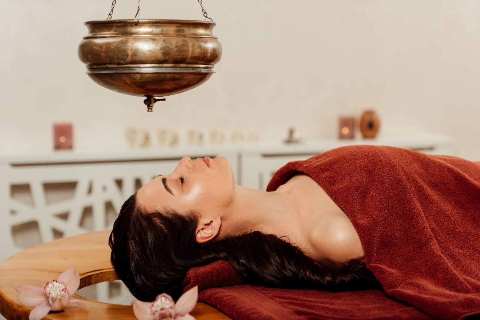 woman receiving ayurvedic treatment on wooden tabl 2026 01 06 00 42 36 utc scaled